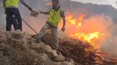 Siirt’te kurtarma ekibi, evinin önündeki yangına müdahale eden kadına yardım etti