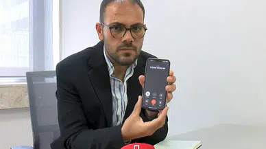 Telefonda gazeteciyi dolandırma girişimi kamerada