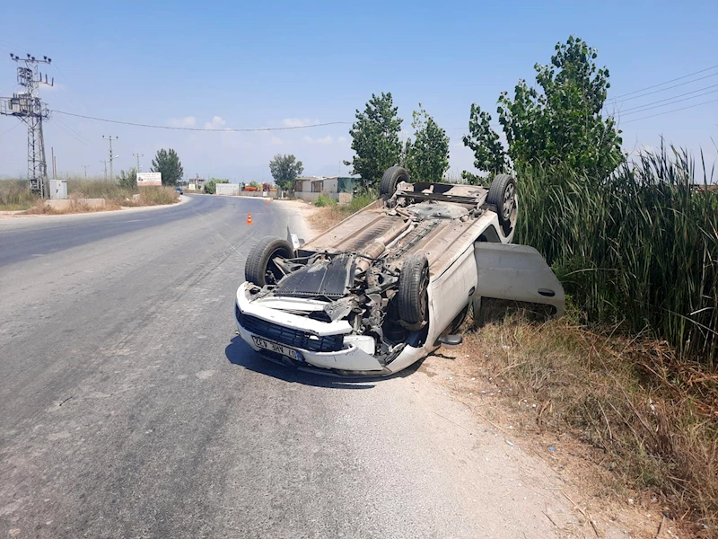 Takla atan otomobilde yaralanmadan kurtuldu